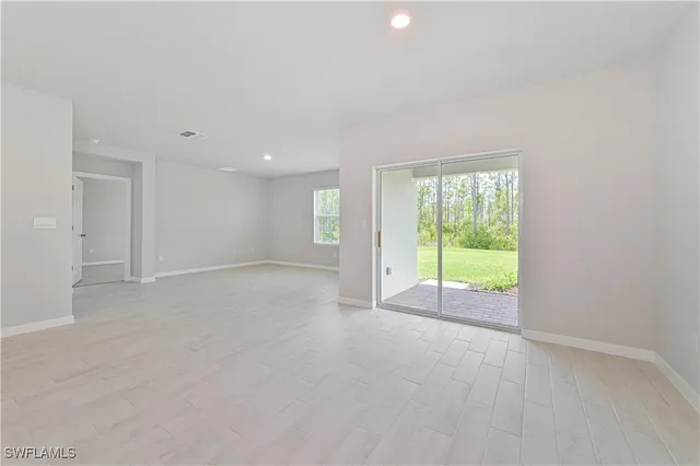 a view of an empty room with a sliding door