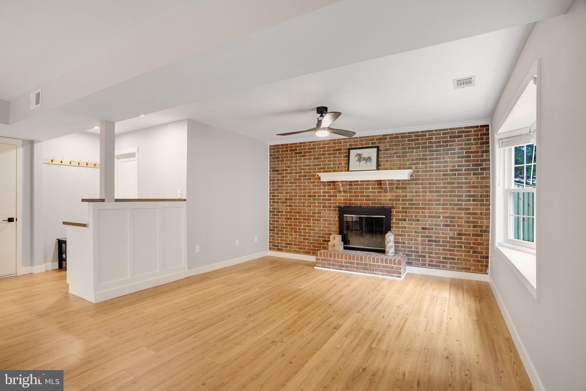 7628 Gralnick Place Springfield, VA 22153 - Photo 17 of 60 Family Room with cozy fireplace