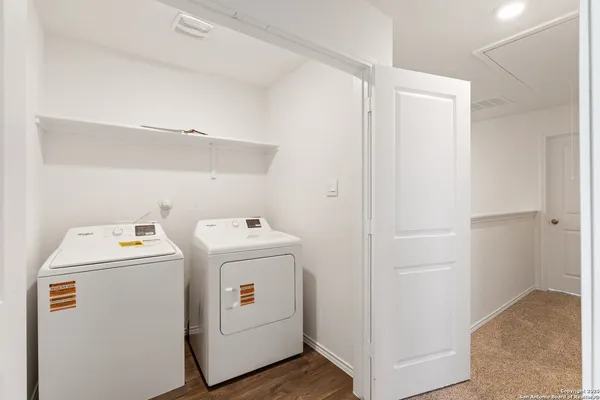 a view of storage and utility room with washer and dryer