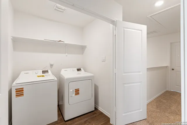 a view of storage and utility room with washer and dryer