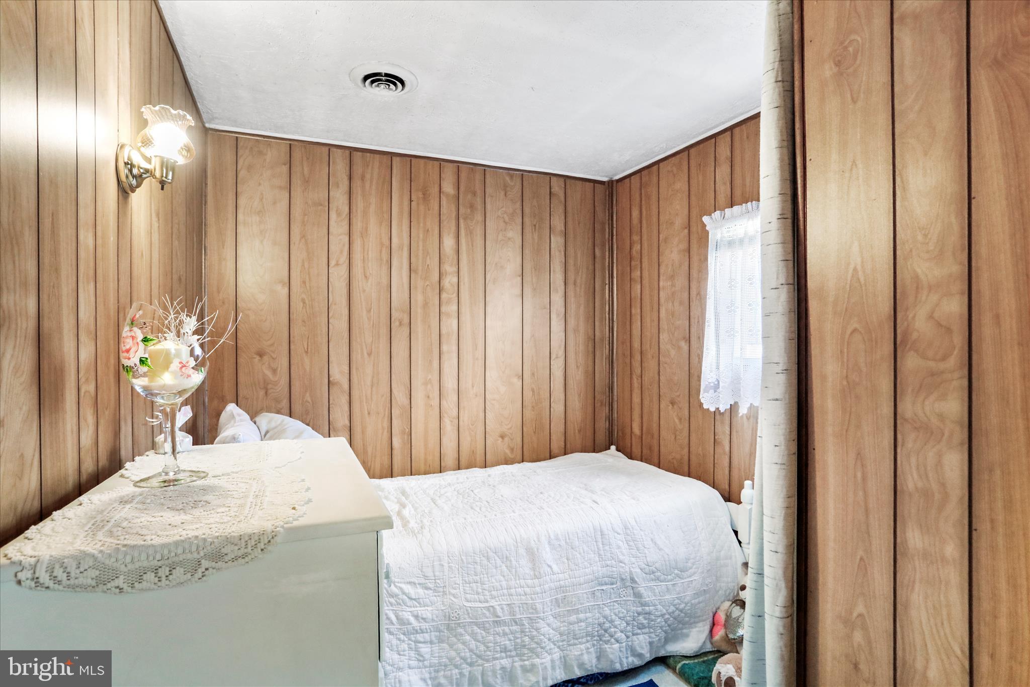 146 Miracle Drive Springfield, WV 26763 - Photo 12 of 40 a bedroom with a bed and a window