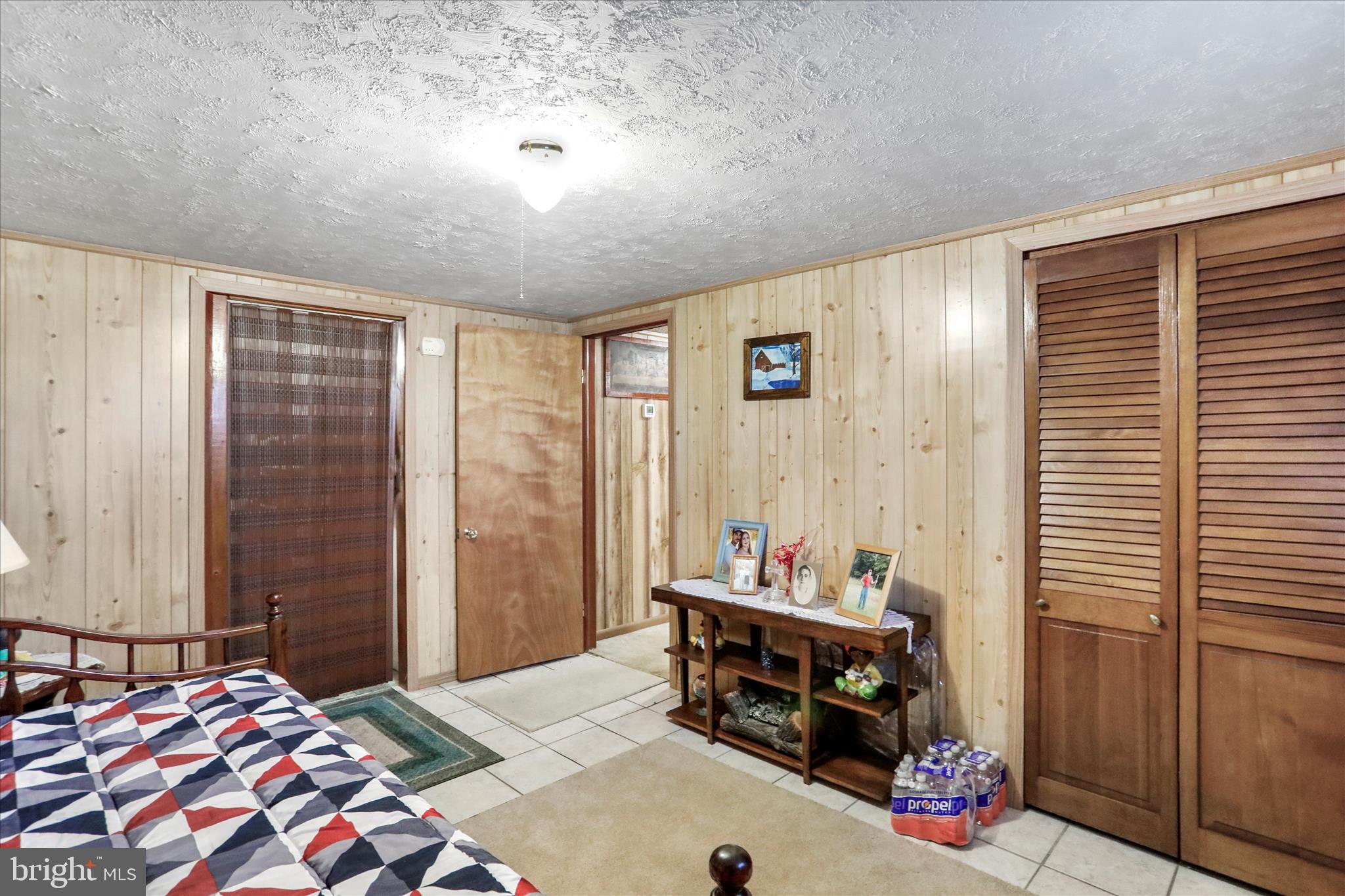 146 Miracle Drive Springfield, WV 26763 - Photo 23 of 40 a bedroom with a bed and a dresser