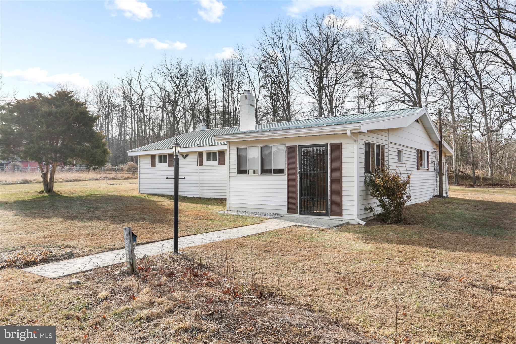 146 Miracle Drive Springfield, WV 26763 - Photo 3 of 40 a view of a house with a yard and large tree