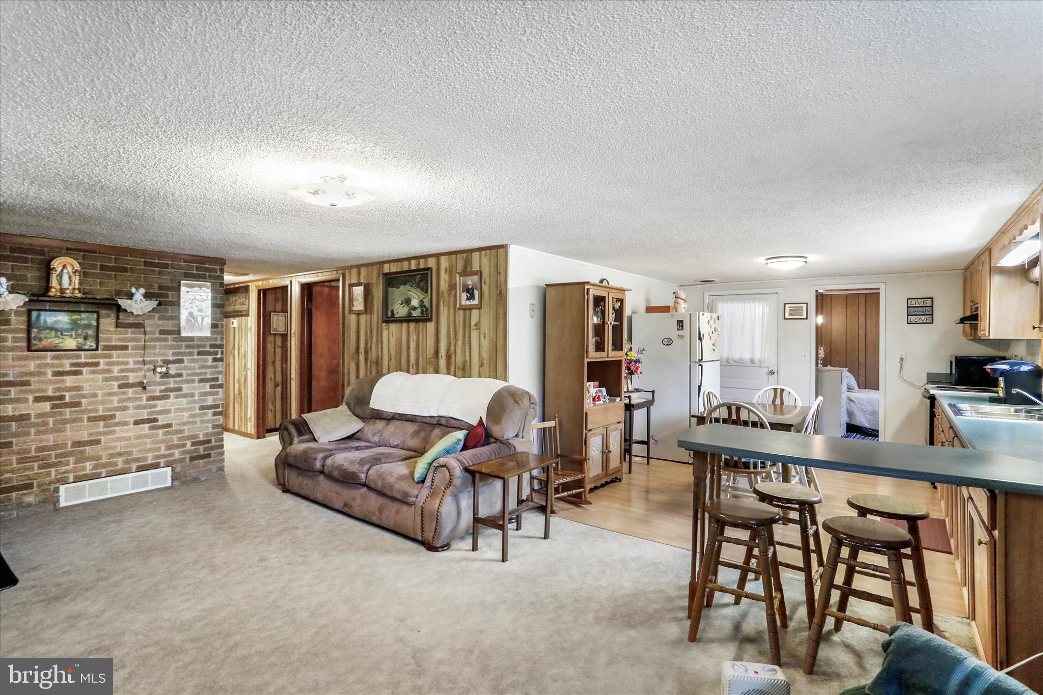 146 Miracle Drive Springfield, WV 26763 - Photo 4 of 40 a living room with furniture a rug and white walls