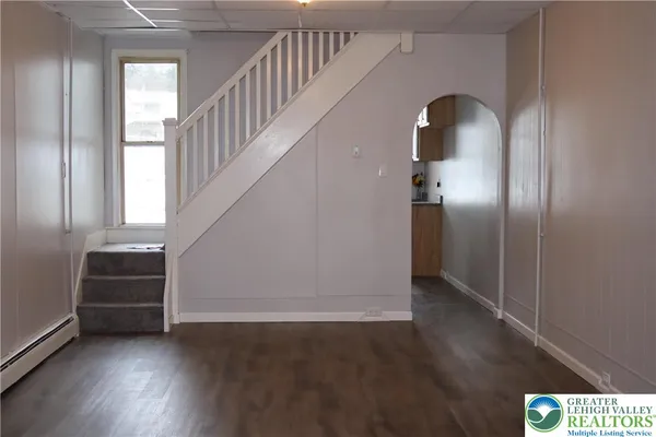 a view of entryway with wooden floor
