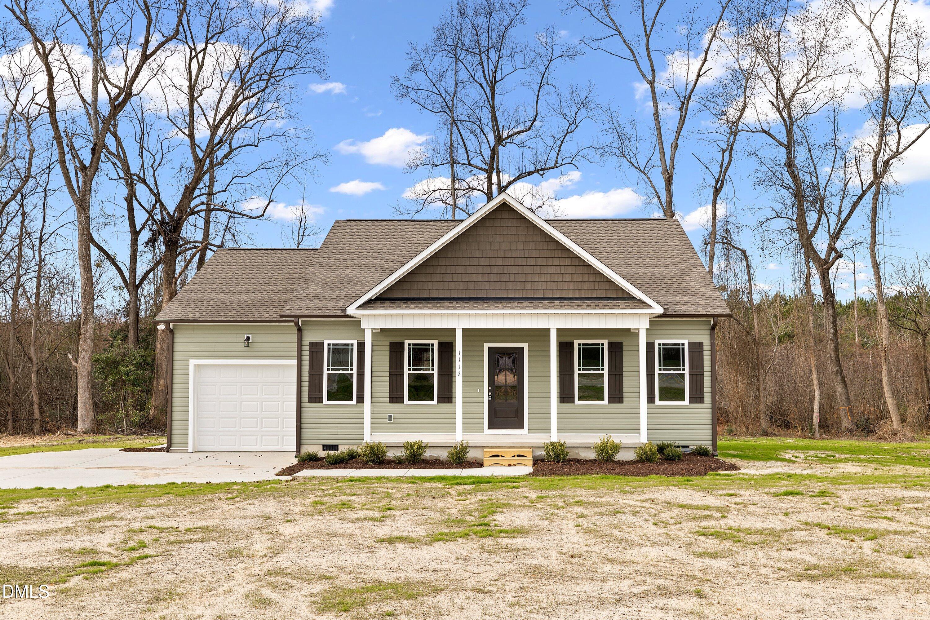 1117 Nor-Am Road Pikeville, NC 27863 - Photo 1 of 34 a house that has a tree in front of it