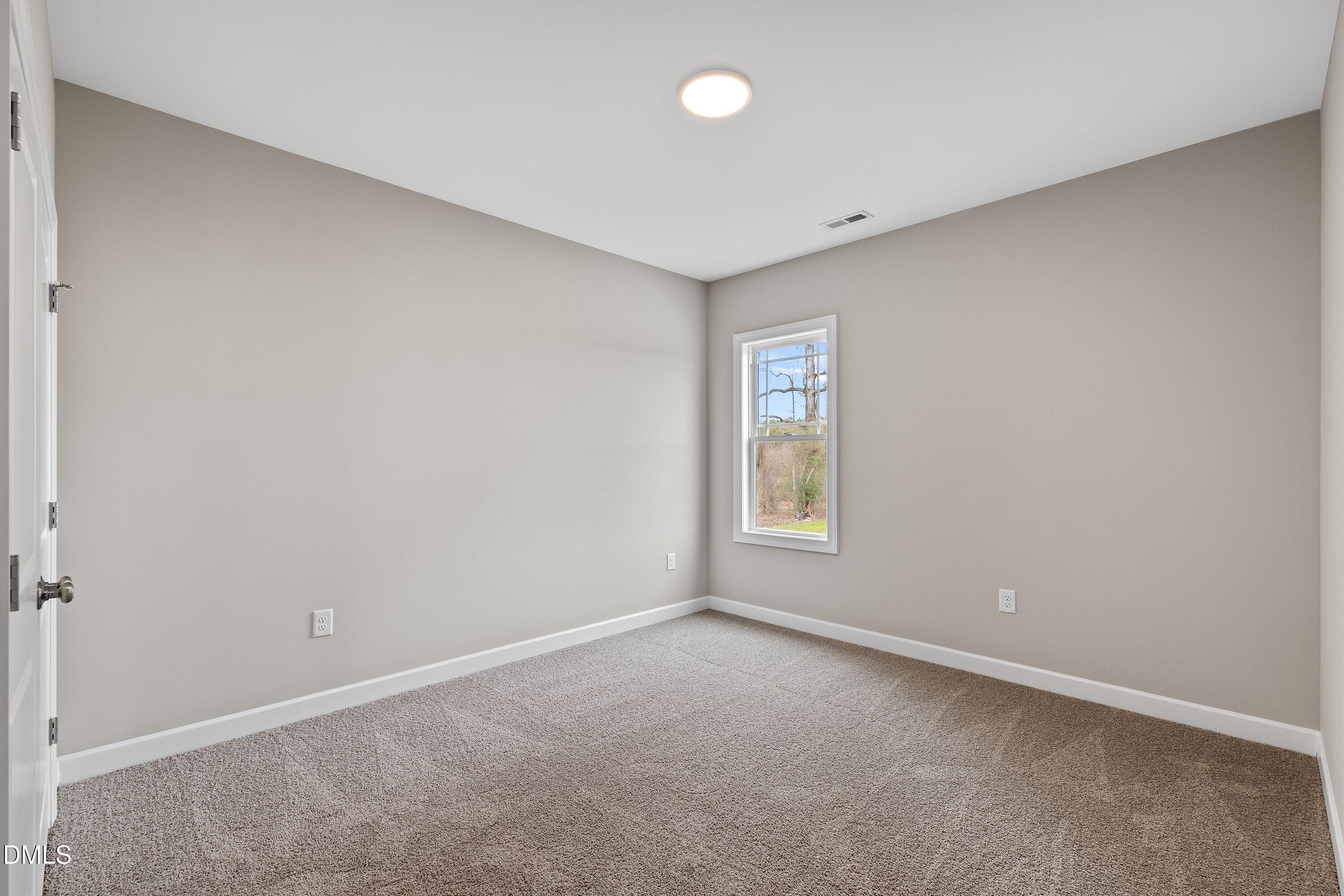 1117 Nor-Am Road Pikeville, NC 27863 - Photo 16 of 34 an empty room with a window
