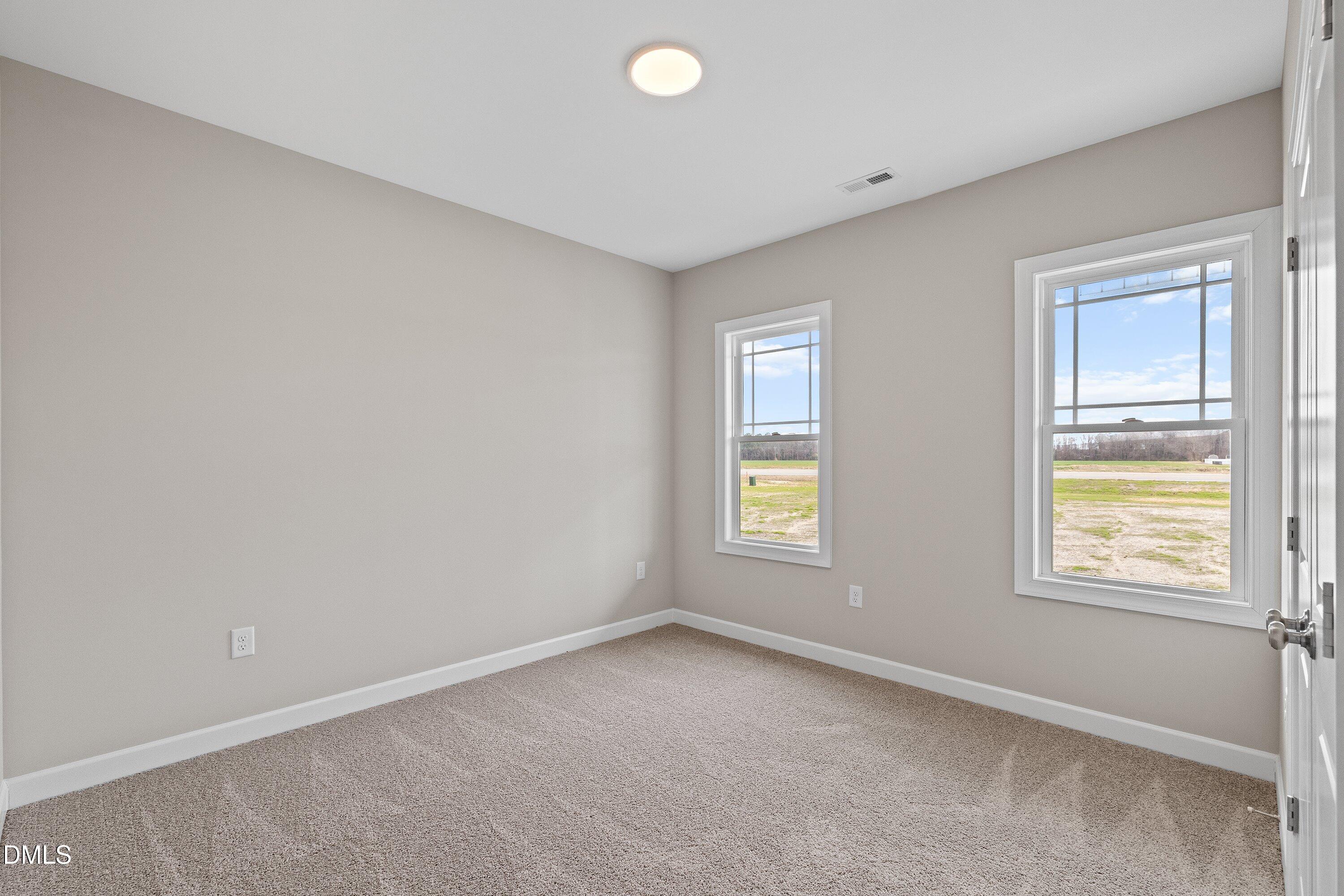 1117 Nor-Am Road Pikeville, NC 27863 - Photo 18 of 34 an empty room with windows