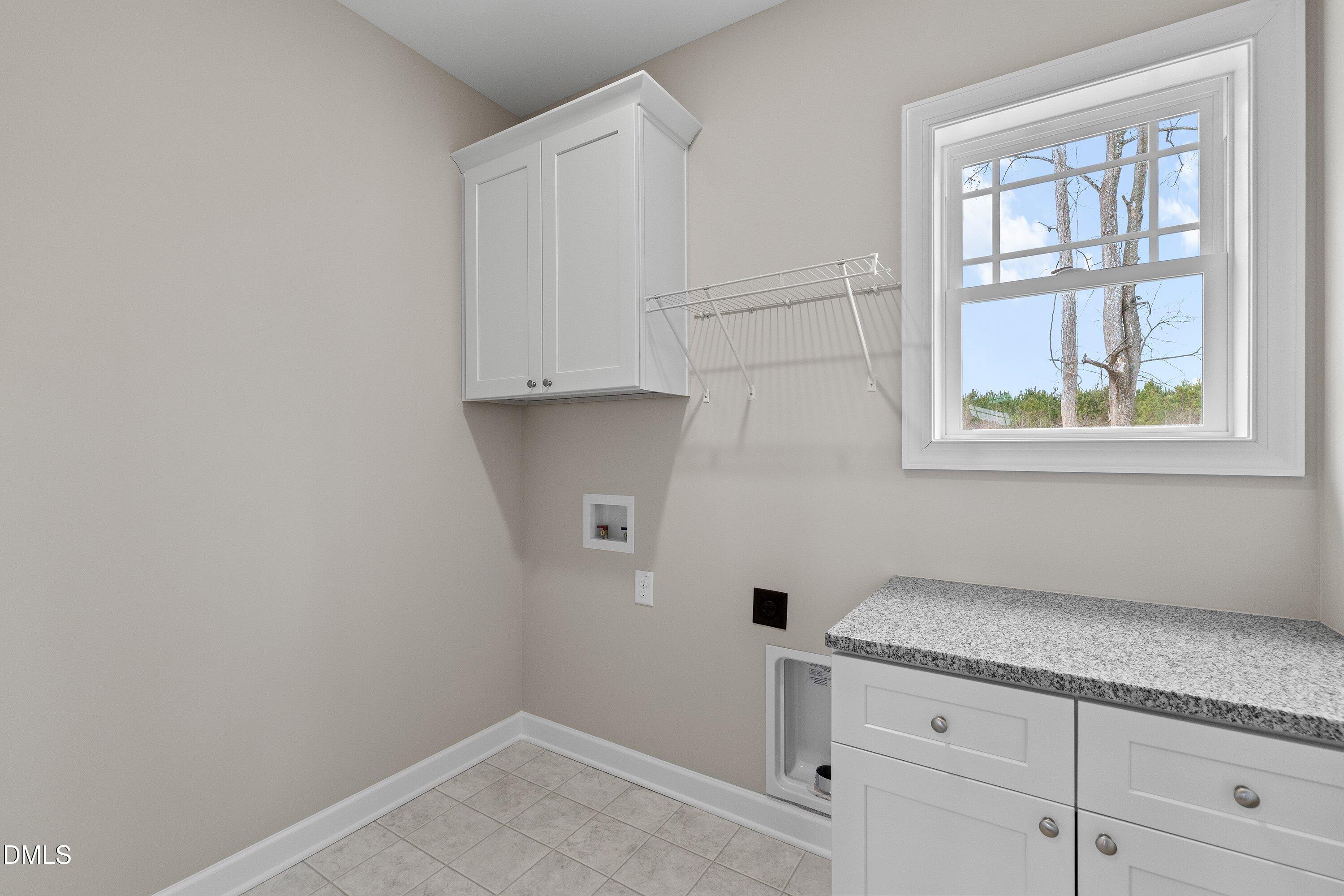 1117 Nor-Am Road Pikeville, NC 27863 - Photo 21 of 34 a room with cabinet and window