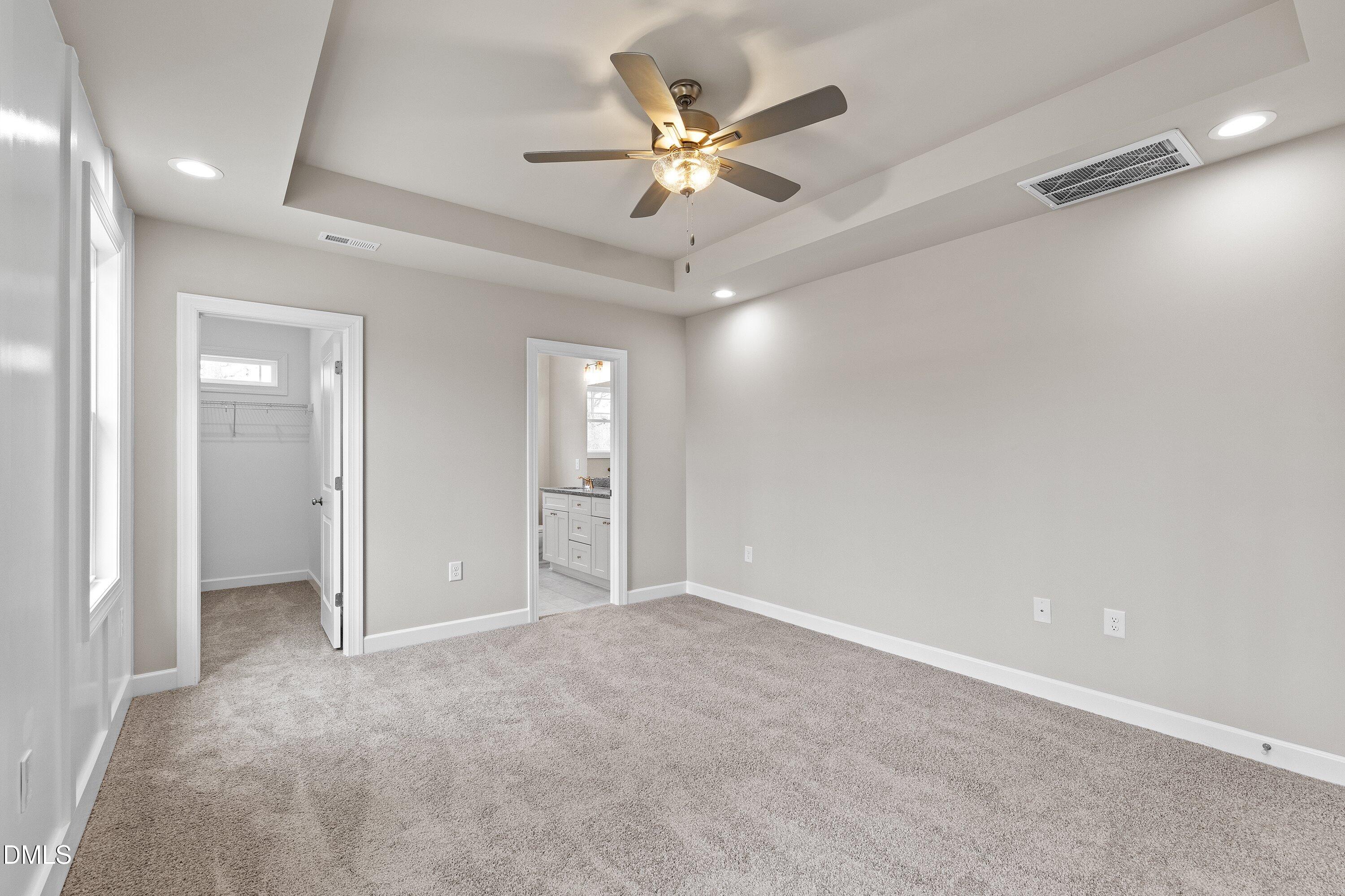 1117 Nor-Am Road Pikeville, NC 27863 - Photo 23 of 34 wooden floor in an empty room with a ceiling fan