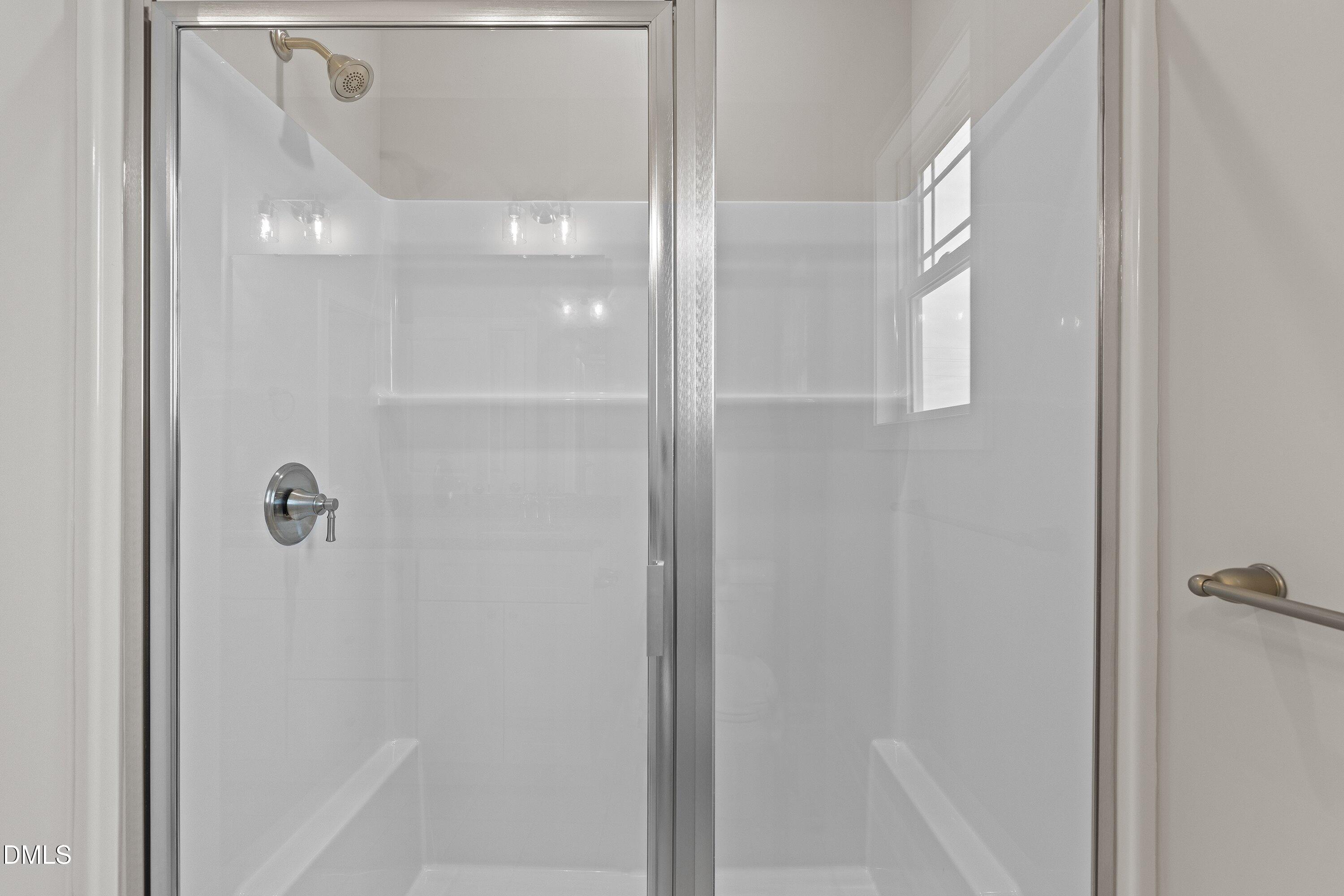 1117 Nor-Am Road Pikeville, NC 27863 - Photo 28 of 34 a bathroom with a glass shower door