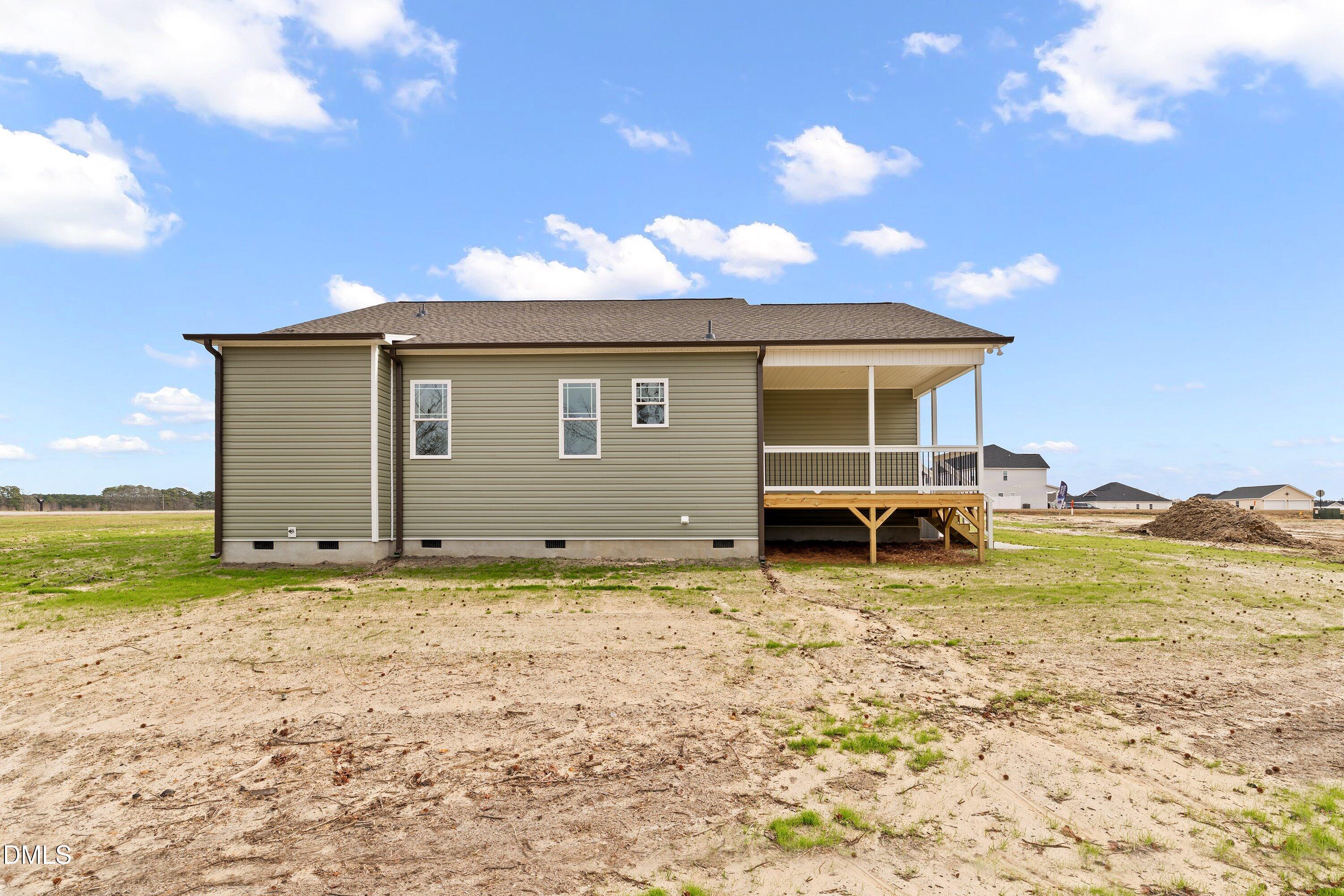 1117 Nor-Am Road Pikeville, NC 27863 - Photo 30 of 34 a view of a house with a backyard