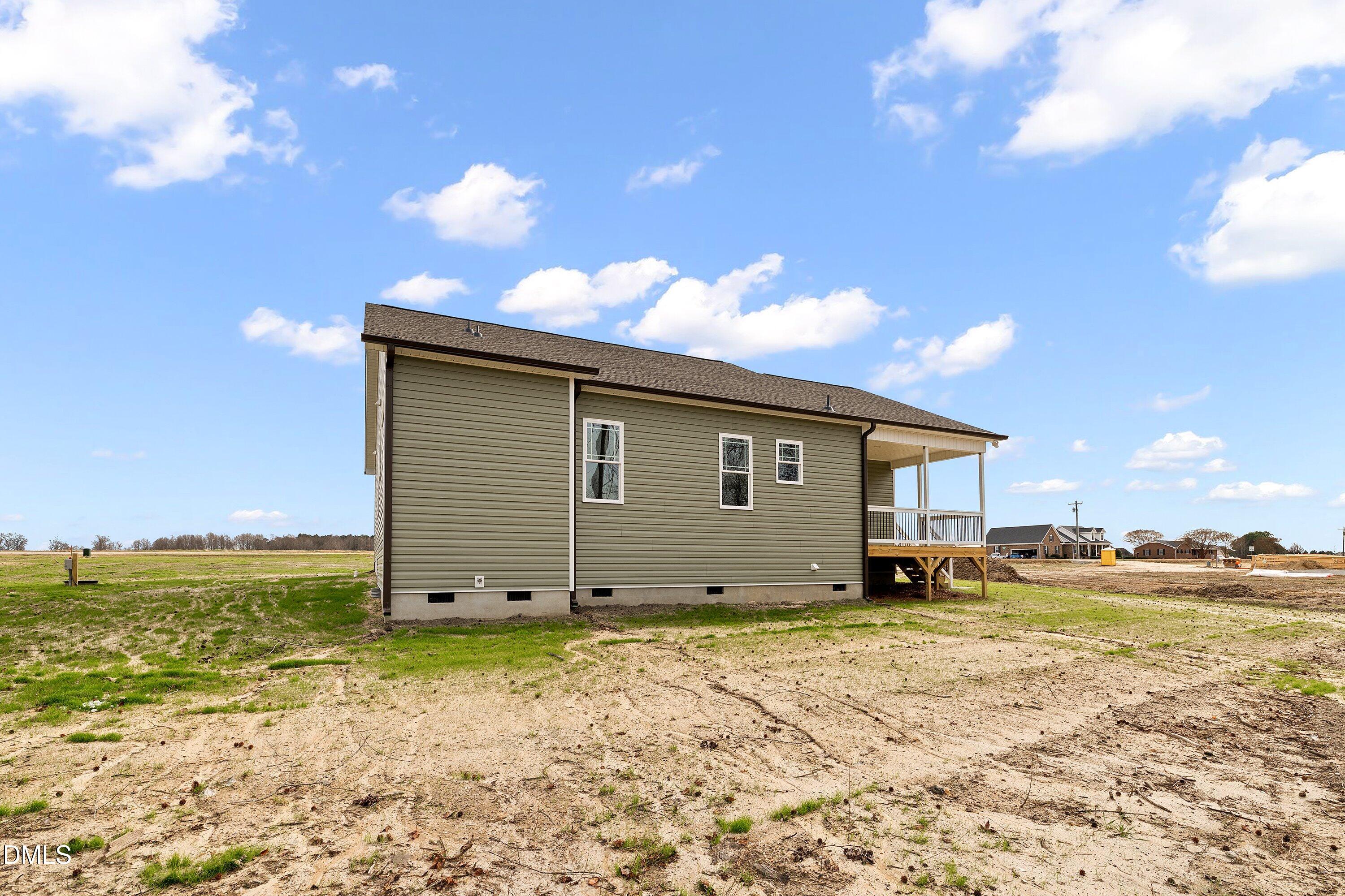 1117 Nor-Am Road Pikeville, NC 27863 - Photo 32 of 34 a view of a house with a backyard