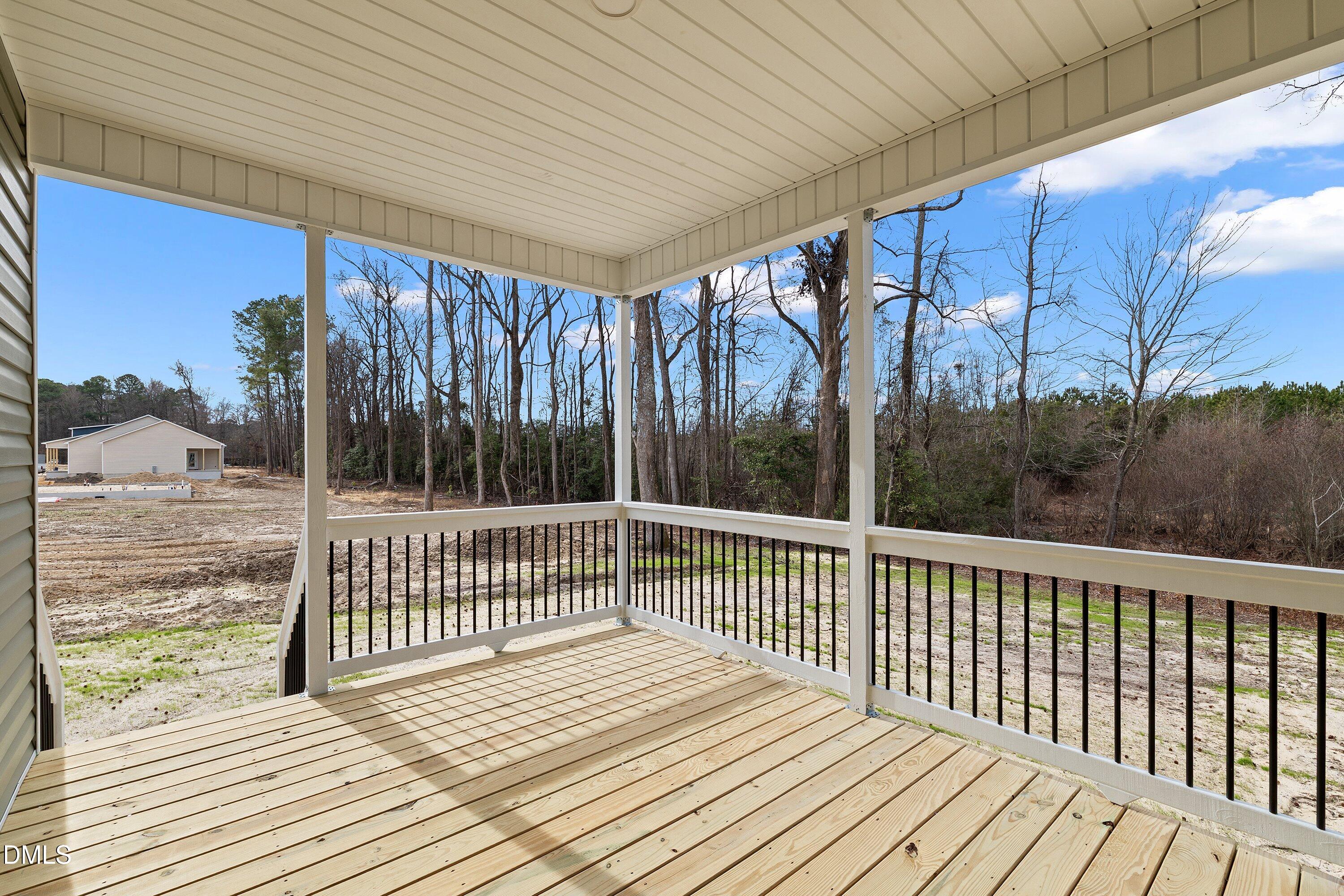 1117 Nor-Am Road Pikeville, NC 27863 - Photo 33 of 34 a view of balcony with wooden floor and fence
