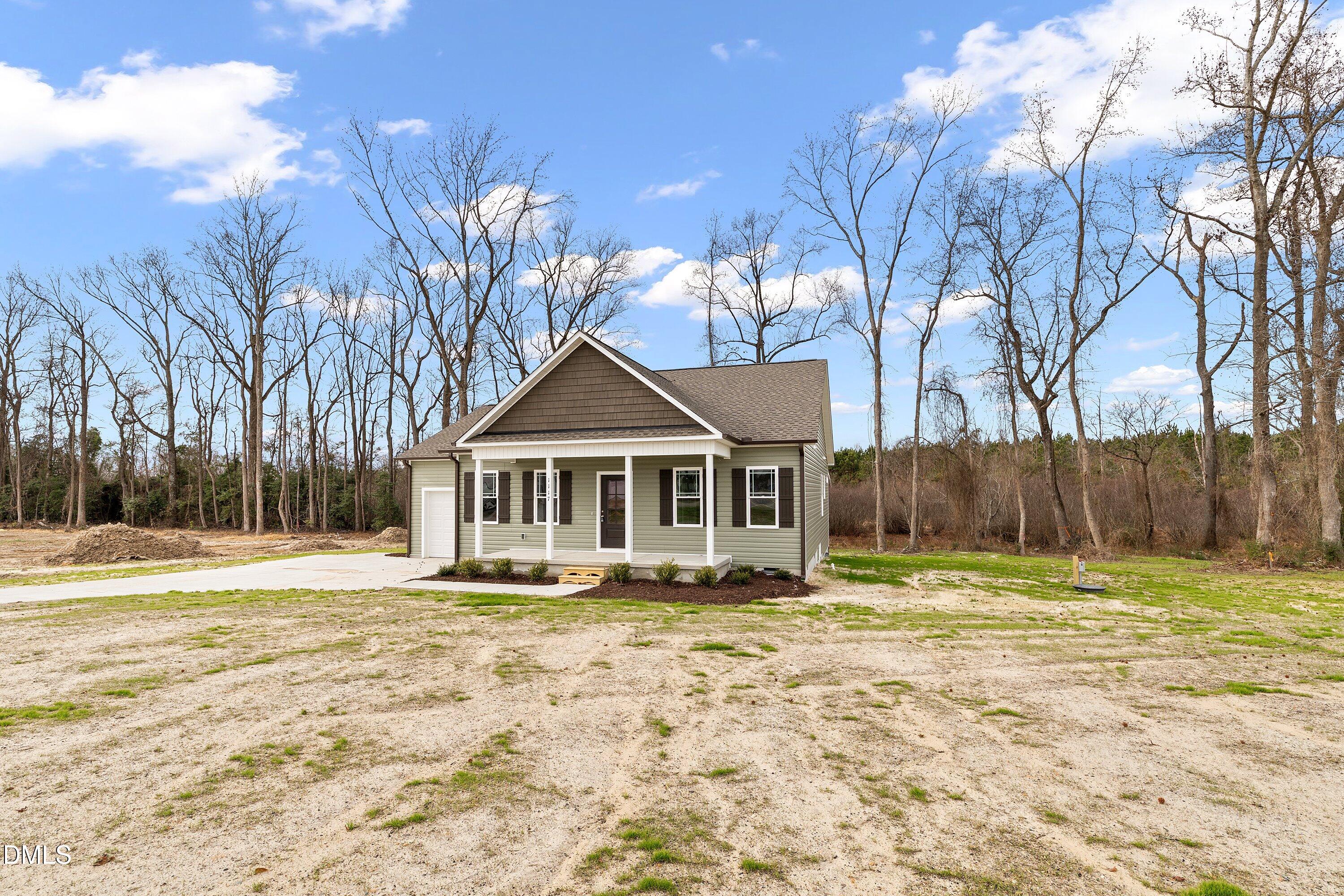 1117 Nor-Am Road Pikeville, NC 27863 - Photo 4 of 34 a front view of a house with a yard