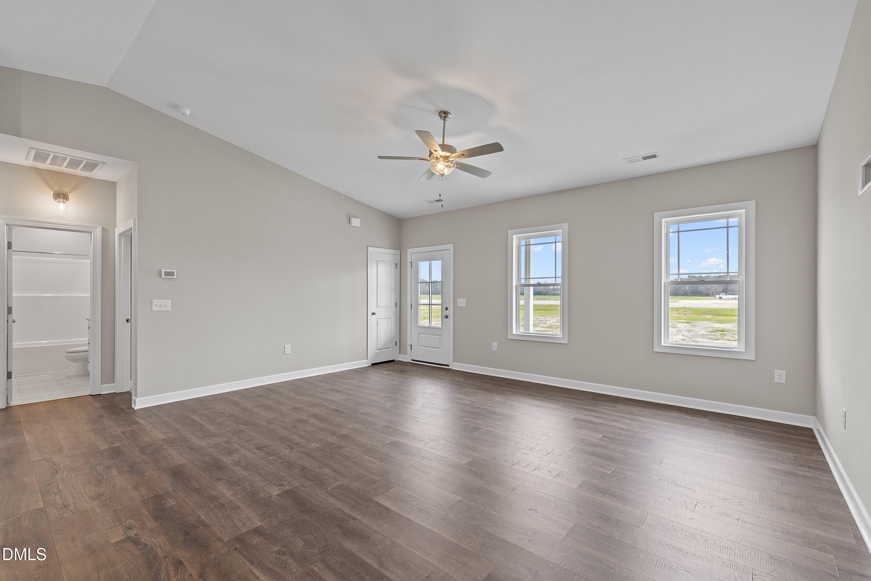 1117 Nor-Am Road Pikeville, NC 27863 - Photo 9 of 34 a view of an empty room with a window and wooden floor