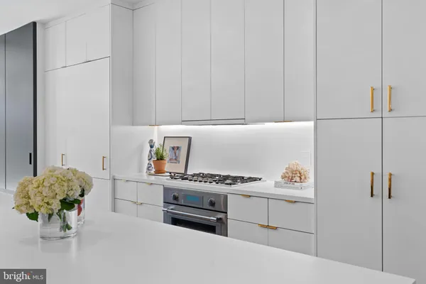 a kitchen with stainless steel appliances a cabinets and a stove