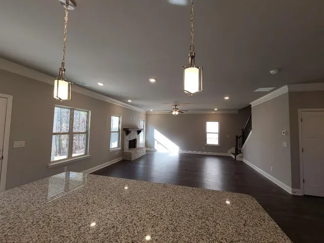 a view of a room with window and wooden floor