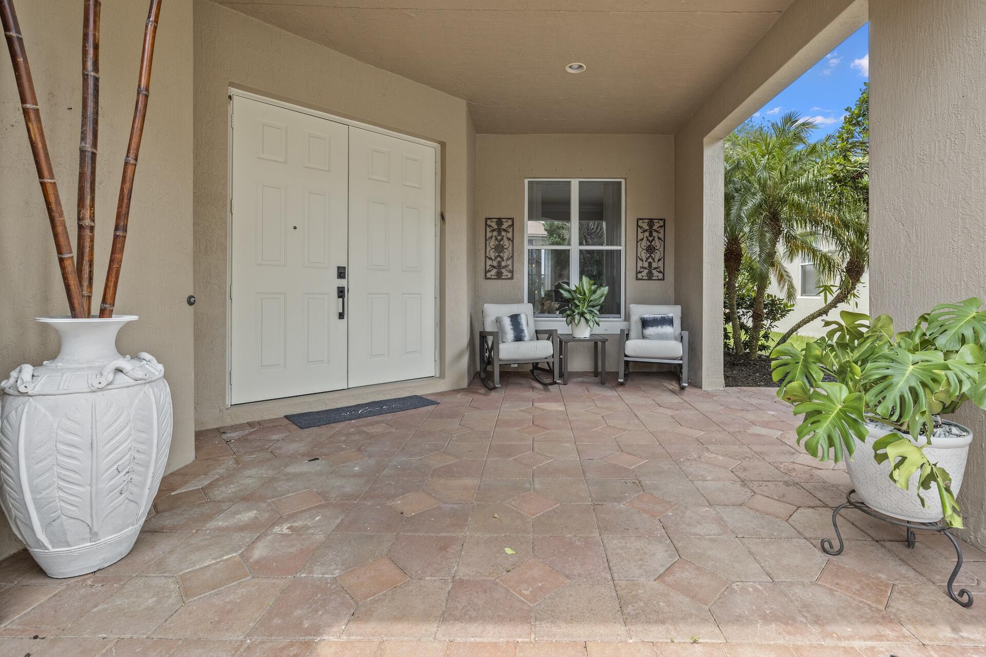 1336 Beacon Circle Wellington, FL 33414 - Photo 3 of 40 front porch