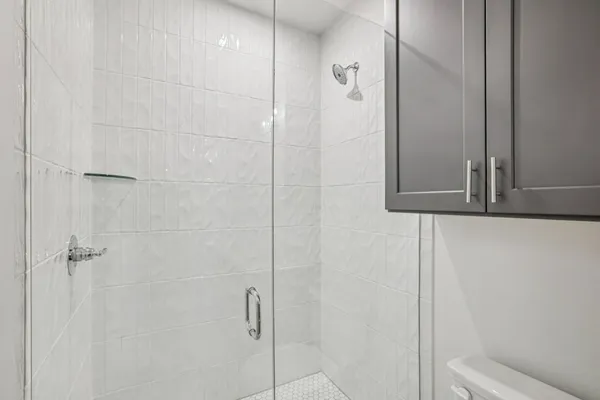 a bathroom with a shower and a sink