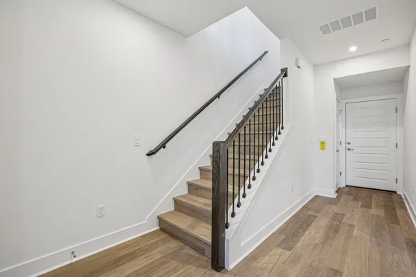 a view of entryway with wooden floor
