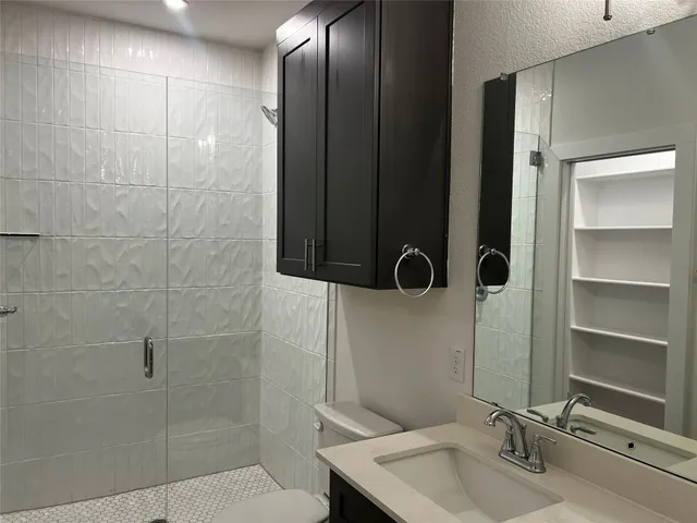 a bathroom with a sink and mirror