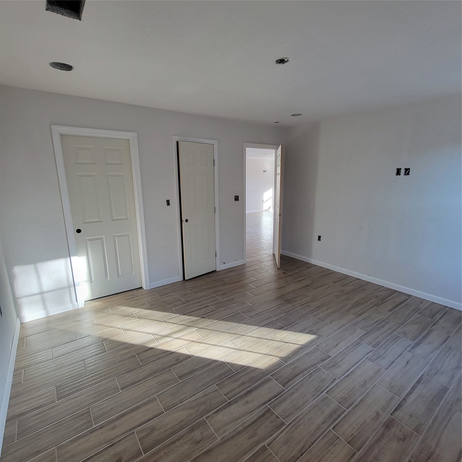 3370 Lorilee Street Beaumont, TX 77708 - Photo 6 of 11 a view of an empty room and wooden floor
