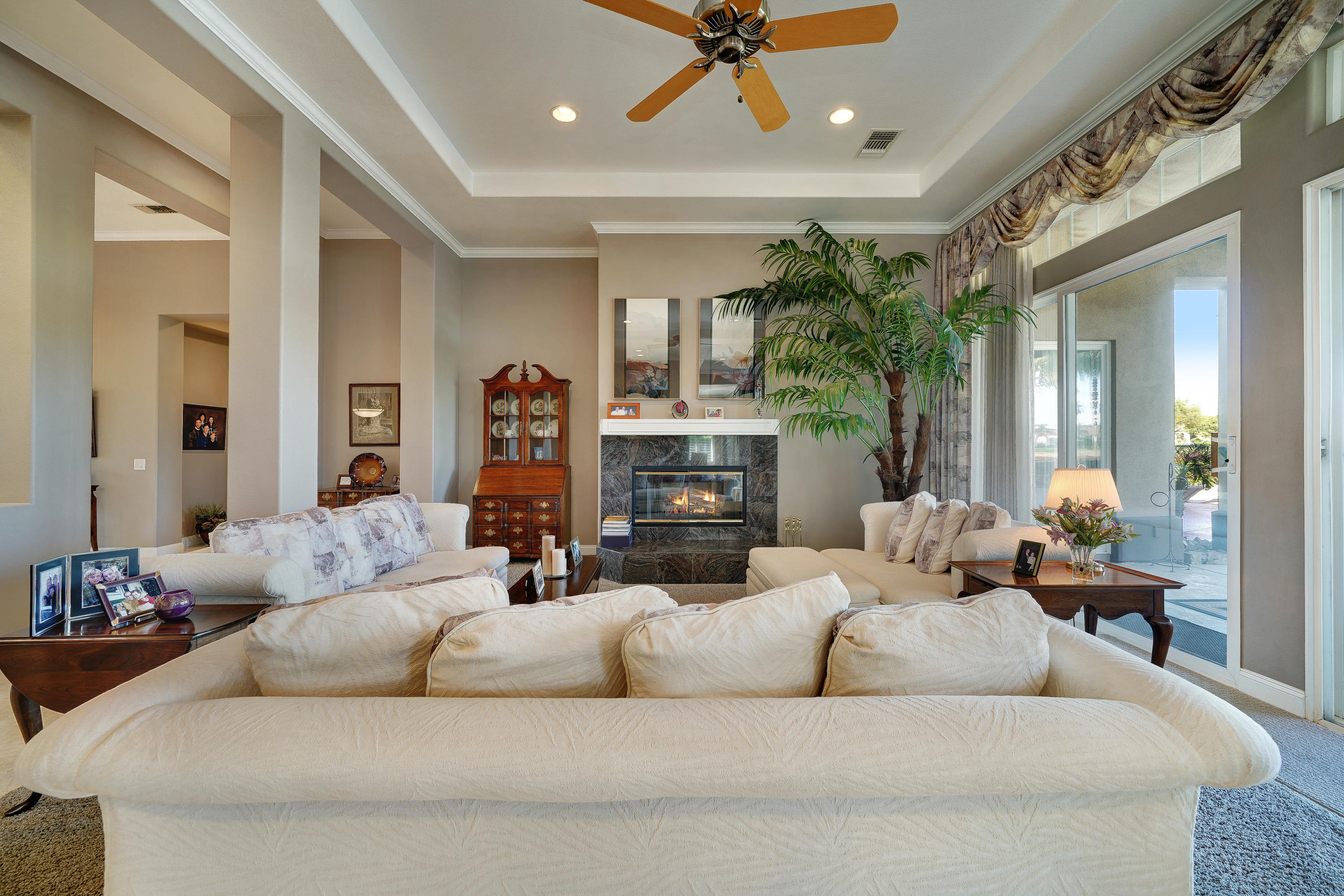 4 Vía Verde Rancho Mirage, CA 92270 - Photo 12 of 63 a living room with furniture and a fireplace