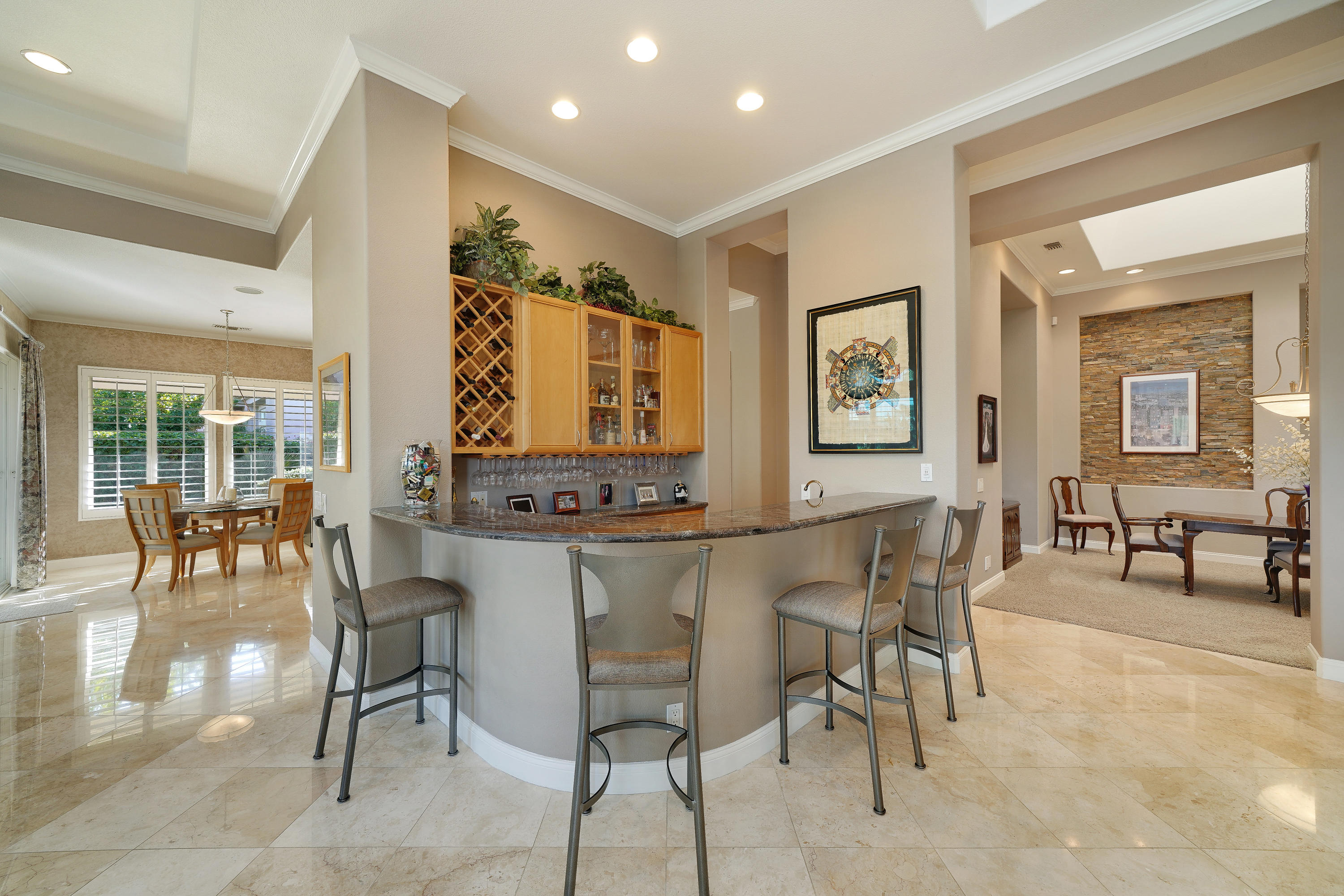 4 Vía Verde Rancho Mirage, CA 92270 - Photo 14 of 63 a dining hall with stainless steel appliances granite countertop a table and chairs