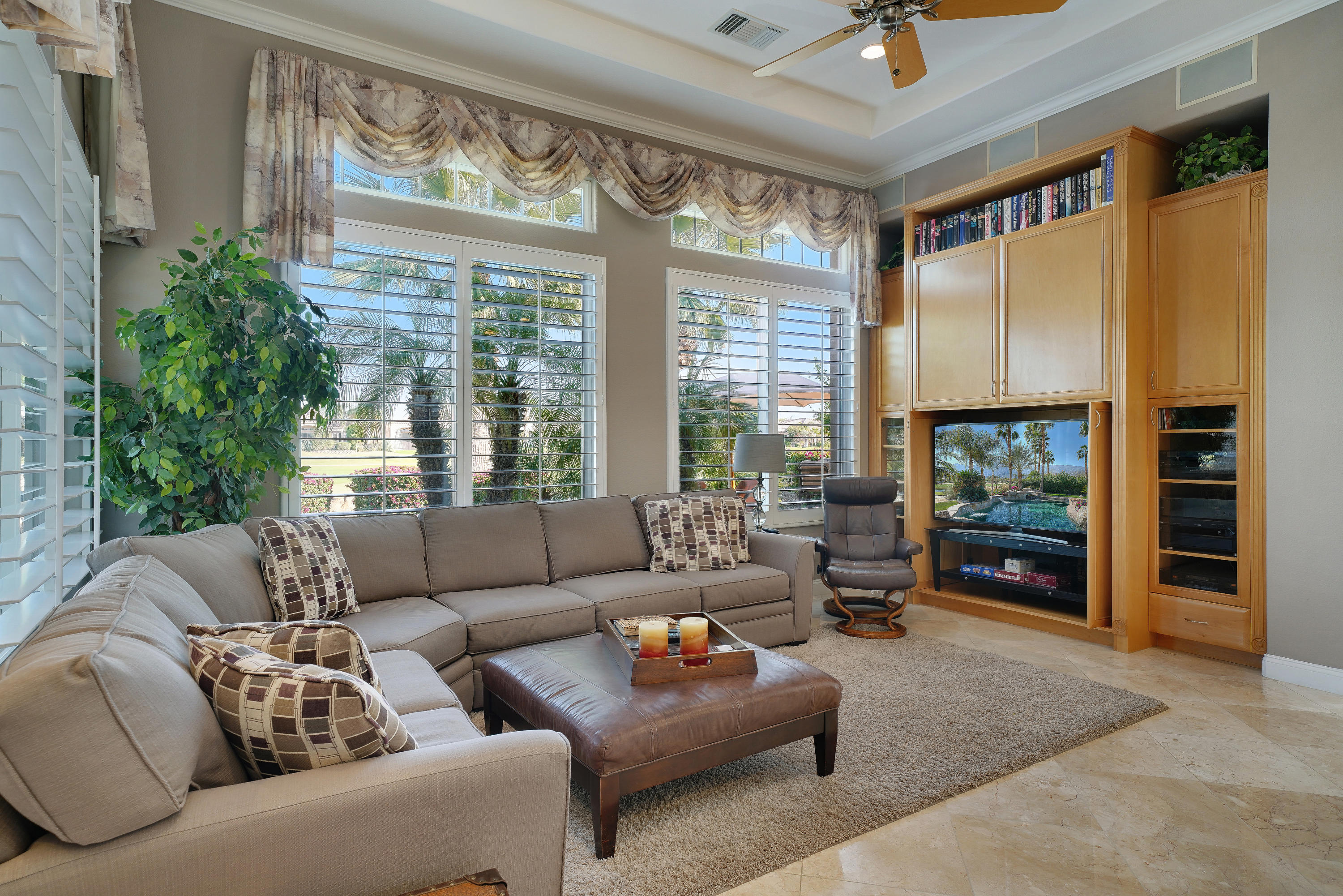 4 Vía Verde Rancho Mirage, CA 92270 - Photo 16 of 63 a living room with furniture and a flat screen tv