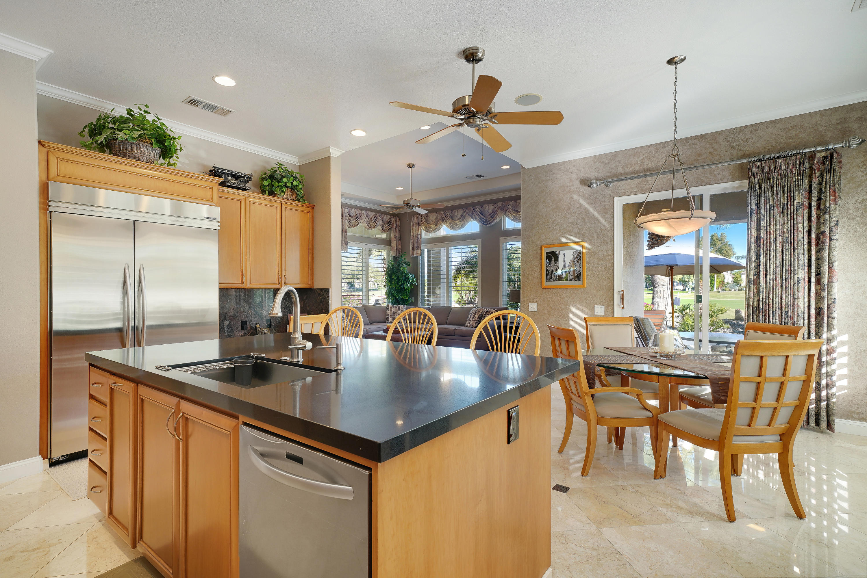 4 Vía Verde Rancho Mirage, CA 92270 - Photo 20 of 63 a kitchen with stainless steel appliances granite countertop a sink a stove and a refrigerator