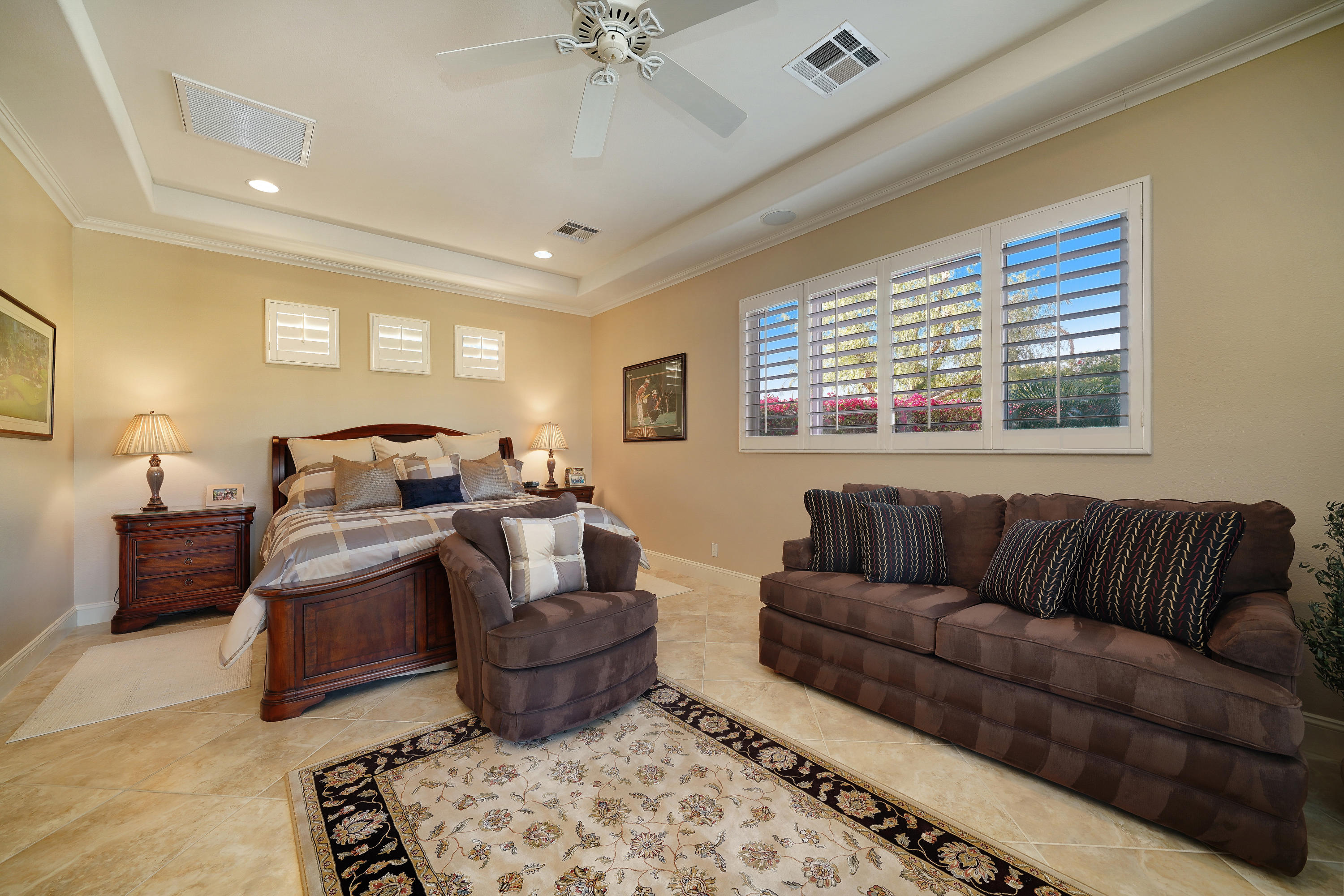 4 Vía Verde Rancho Mirage, CA 92270 - Photo 29 of 63 a living room with furniture ceiling fan and a window