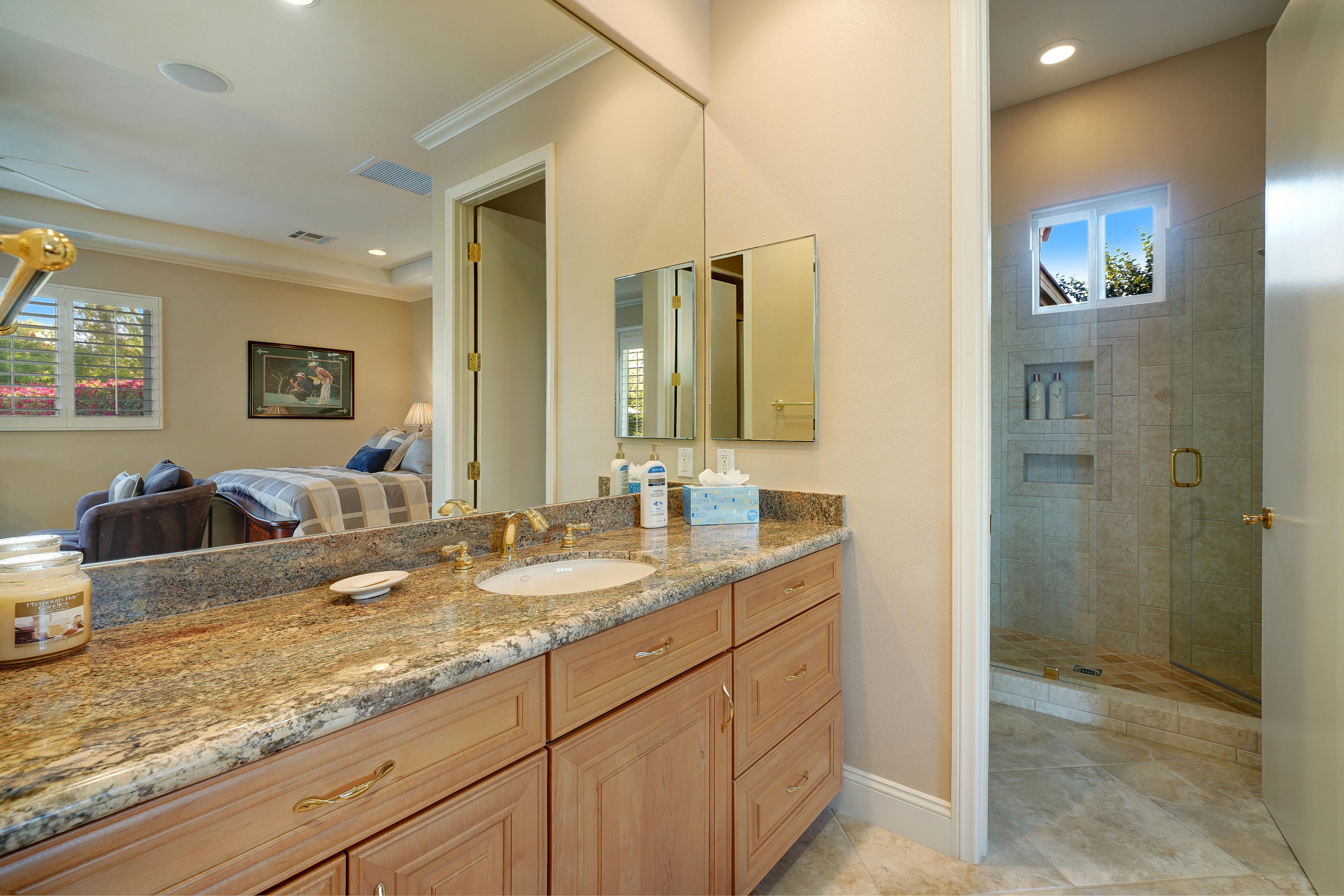 4 Vía Verde Rancho Mirage, CA 92270 - Photo 33 of 63 a bathroom with a granite countertop sink mirror and double