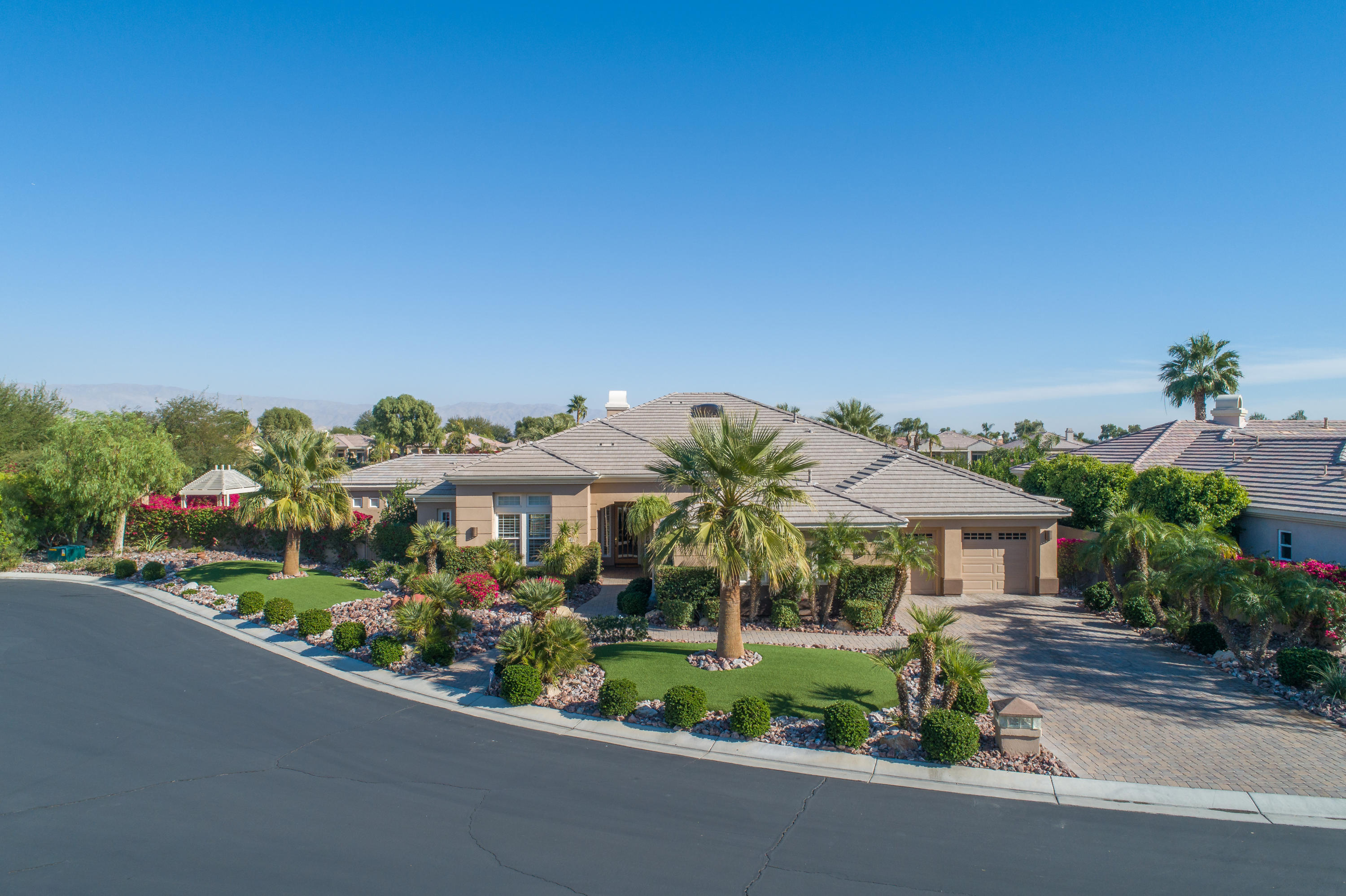 4 Vía Verde Rancho Mirage, CA 92270 - Photo 35 of 63 a view of a house with a garden and pathway