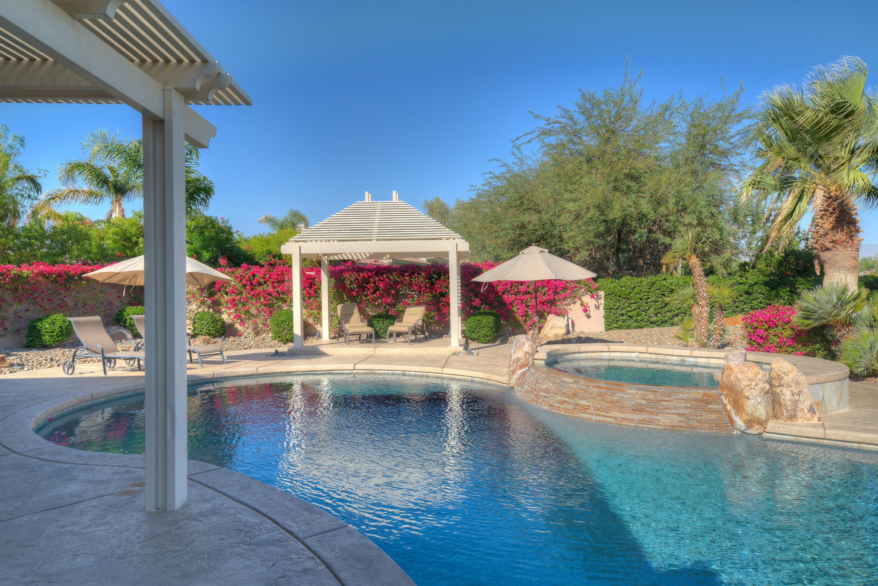 4 Vía Verde Rancho Mirage, CA 92270 - Photo 5 of 63 a view of a street with sitting area