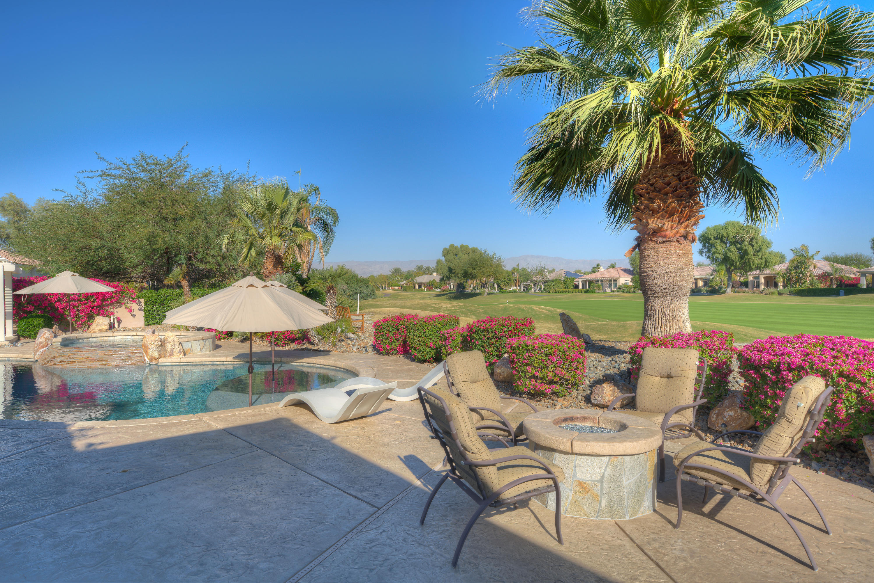 4 Vía Verde Rancho Mirage, CA 92270 - Photo 48 of 63 a view of a patio with furniture and a yard