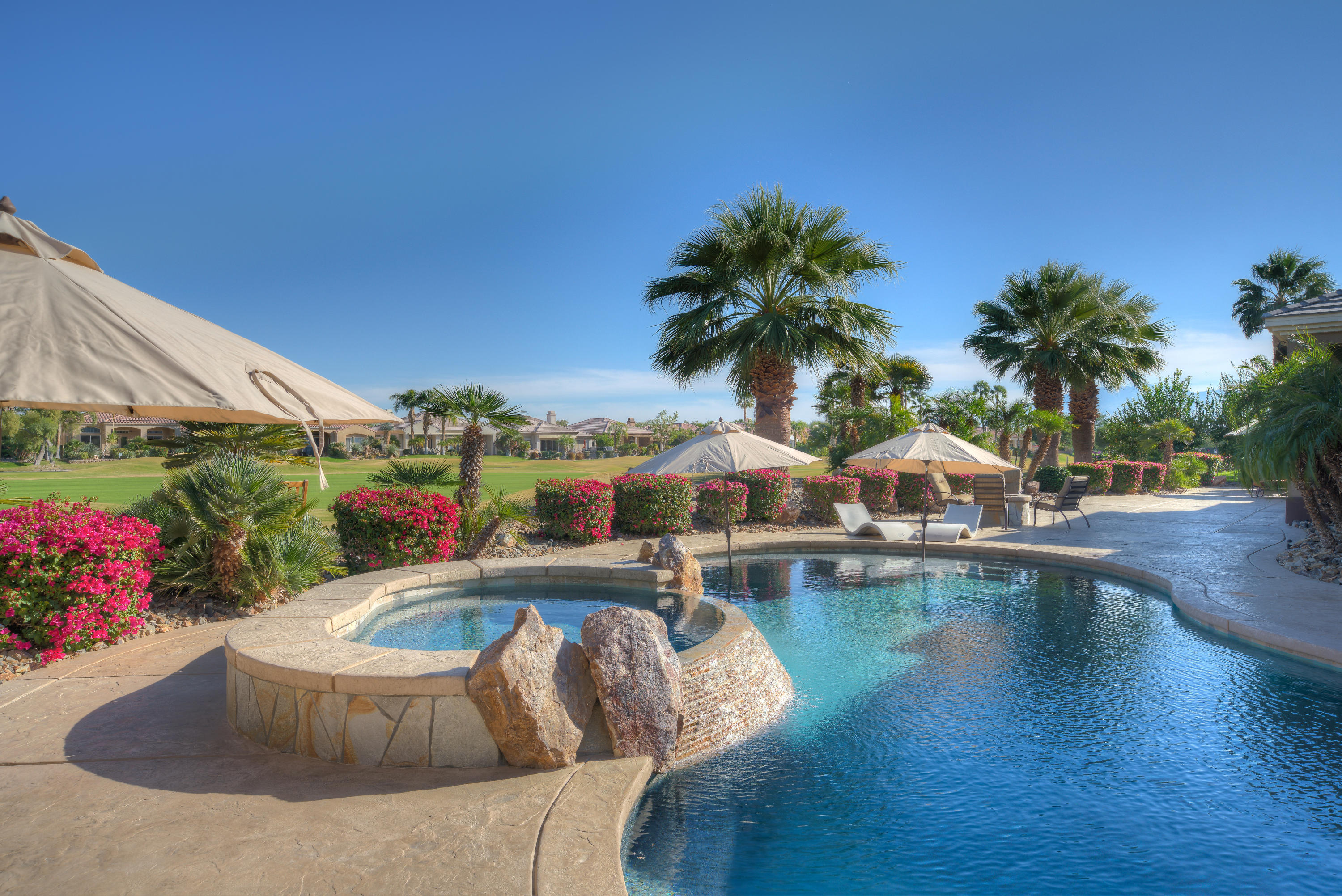 4 Vía Verde Rancho Mirage, CA 92270 - Photo 50 of 63 a view of a swimming pool with lounge chair