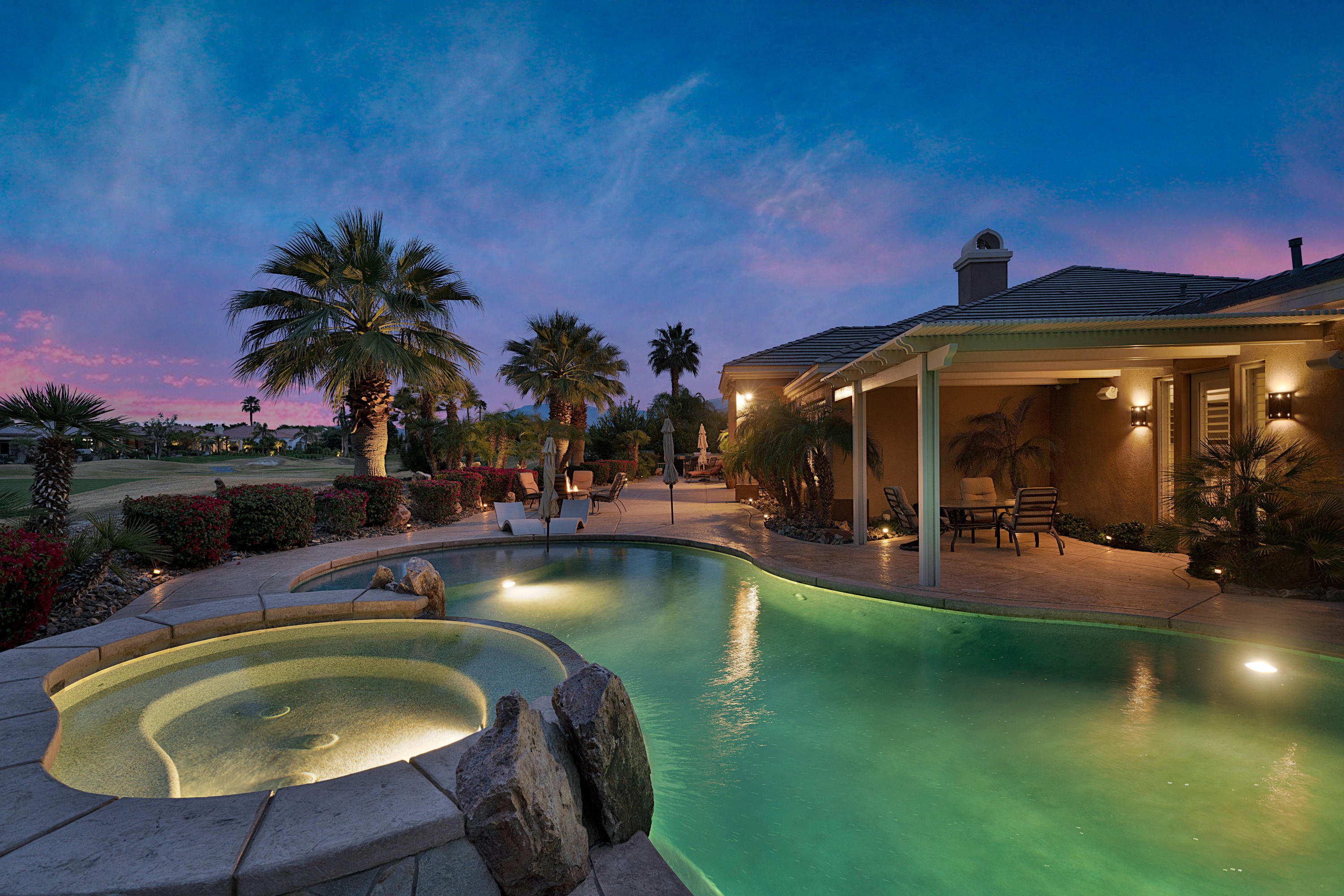 4 Vía Verde Rancho Mirage, CA 92270 - Photo 60 of 63 a view of a swimming pool with lounge chair