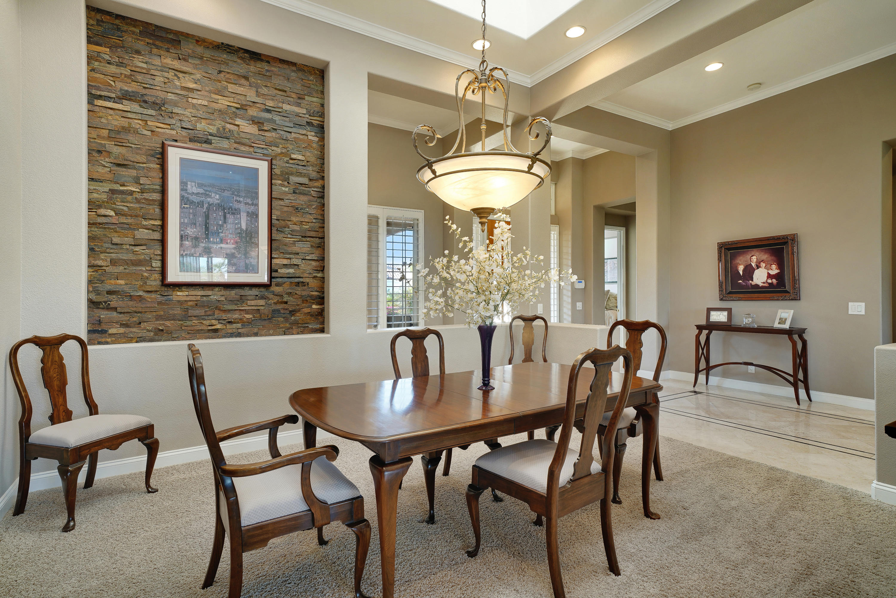 4 Vía Verde Rancho Mirage, CA 92270 - Photo 10 of 63 a view of a dining room with furniture and chandelier