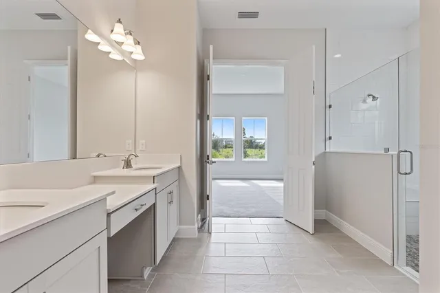 a bathroom with a sink a vanity and a mirror