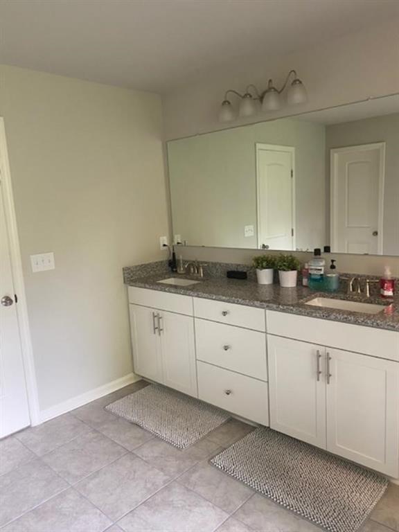 1846 Hamilton Lake Parkway Buford, GA 30519 - Photo 11 of 15 a bathroom with a sink and a mirror