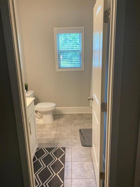 1846 Hamilton Lake Parkway Buford, GA 30519 - Photo 6 of 15 a bathroom with a toilet and a shower