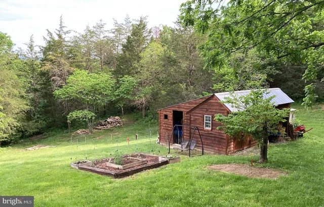 a backyard of a house with lots of green space