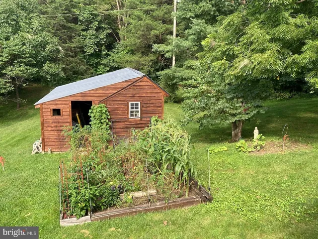 a aerial view of a house with a yard