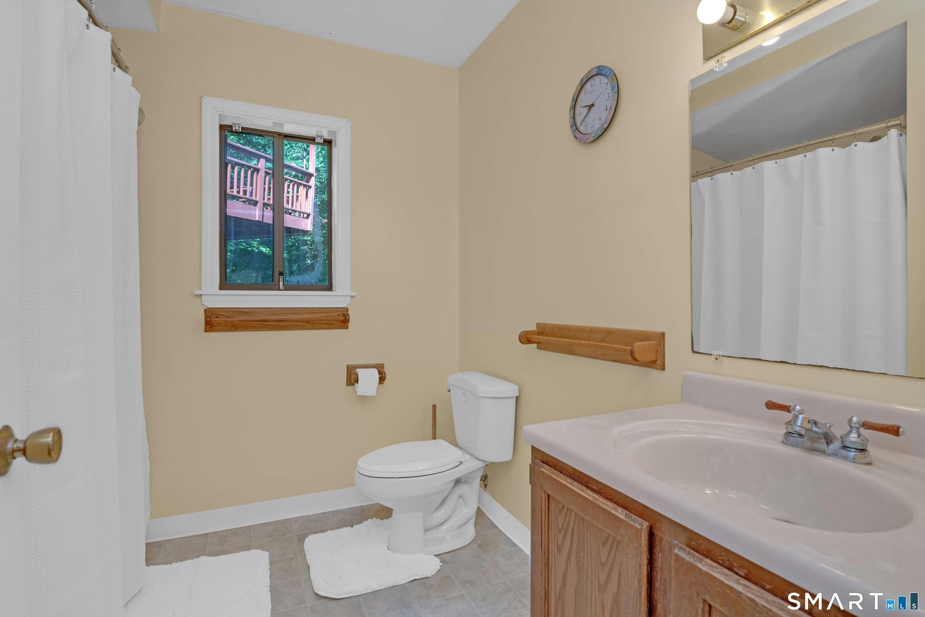 90 Bell Street Manchester, CT 06040 - Photo 26 of 40 a bathroom with a sink toilet and vanity