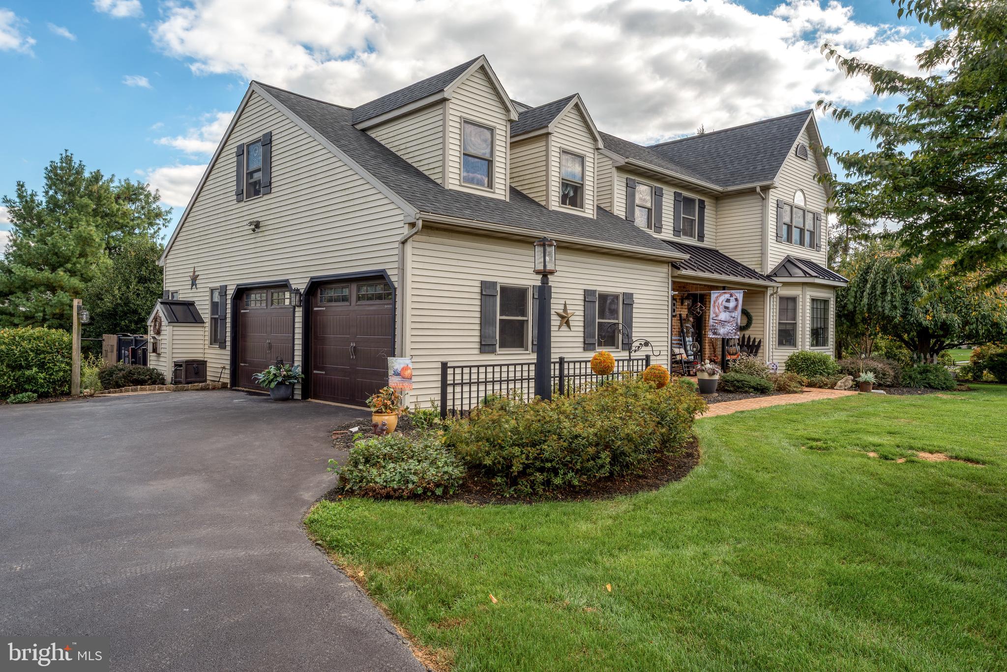 5 Village Drive Lititz, PA 17543 - Photo 2 of 62 a front view of a house with plants and garden