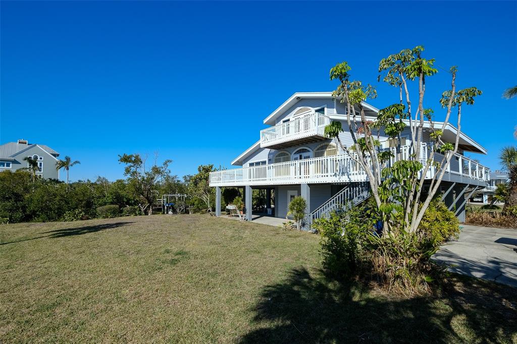145 Burns Road Terra Ceia, FL 34250 - Photo 43 of 65 a front view of a house with a yard