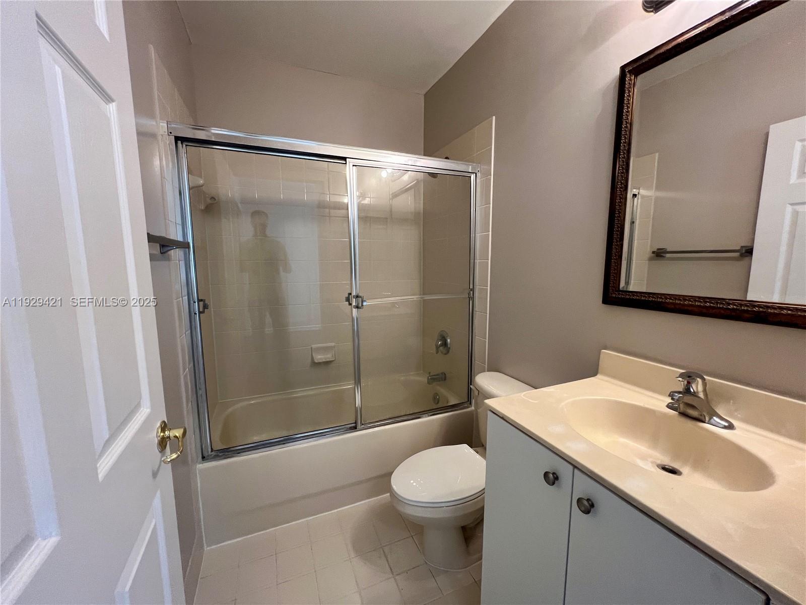8208 Southwest 29th Street, Unit 101 Miramar, FL 33025 - Photo 15 of 19 a bathroom with a sink toilet and shower