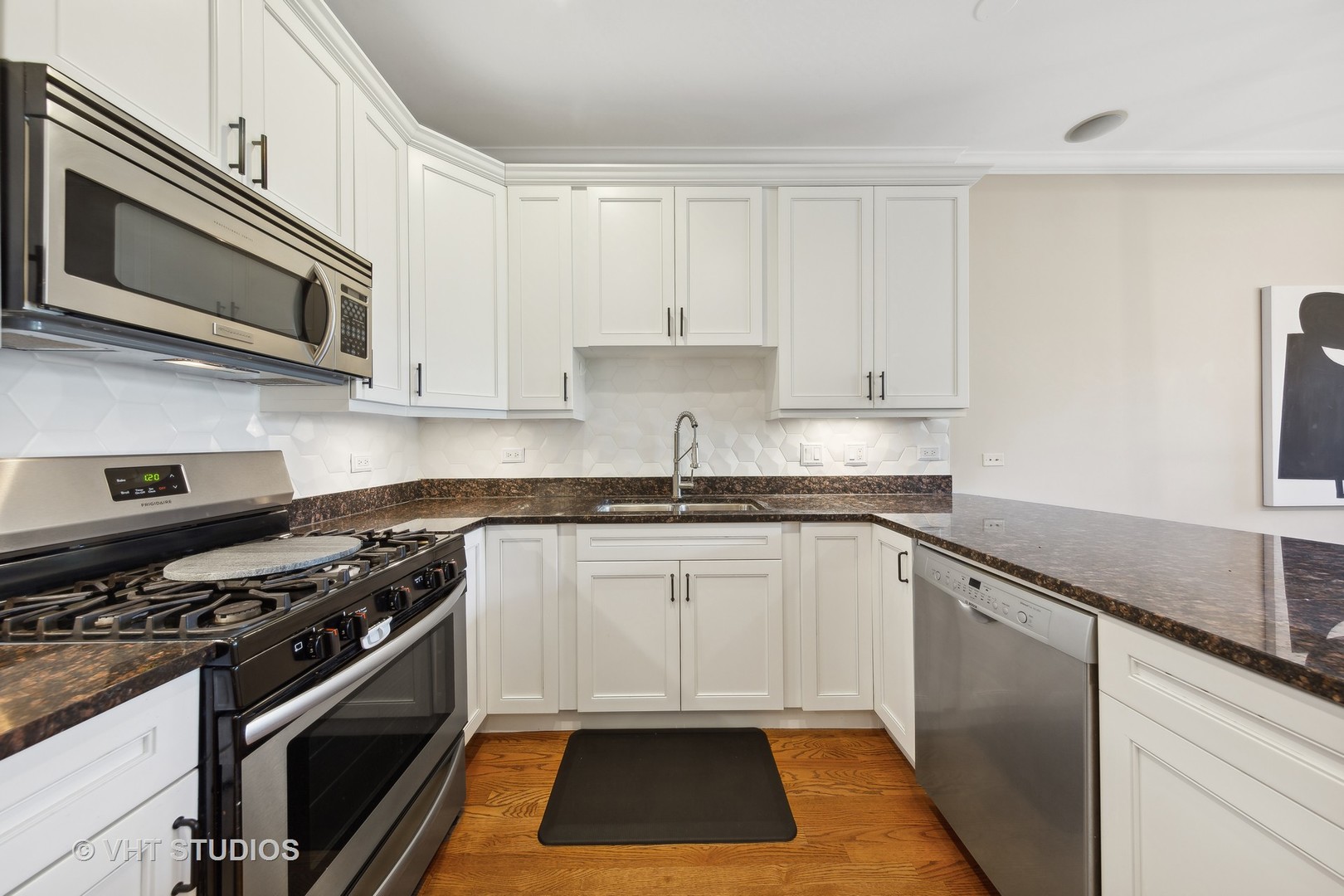 2136 West Division Street, Unit 3 Chicago, IL 60622 - Photo 11 of 37 a kitchen with granite countertop a stove and a sink