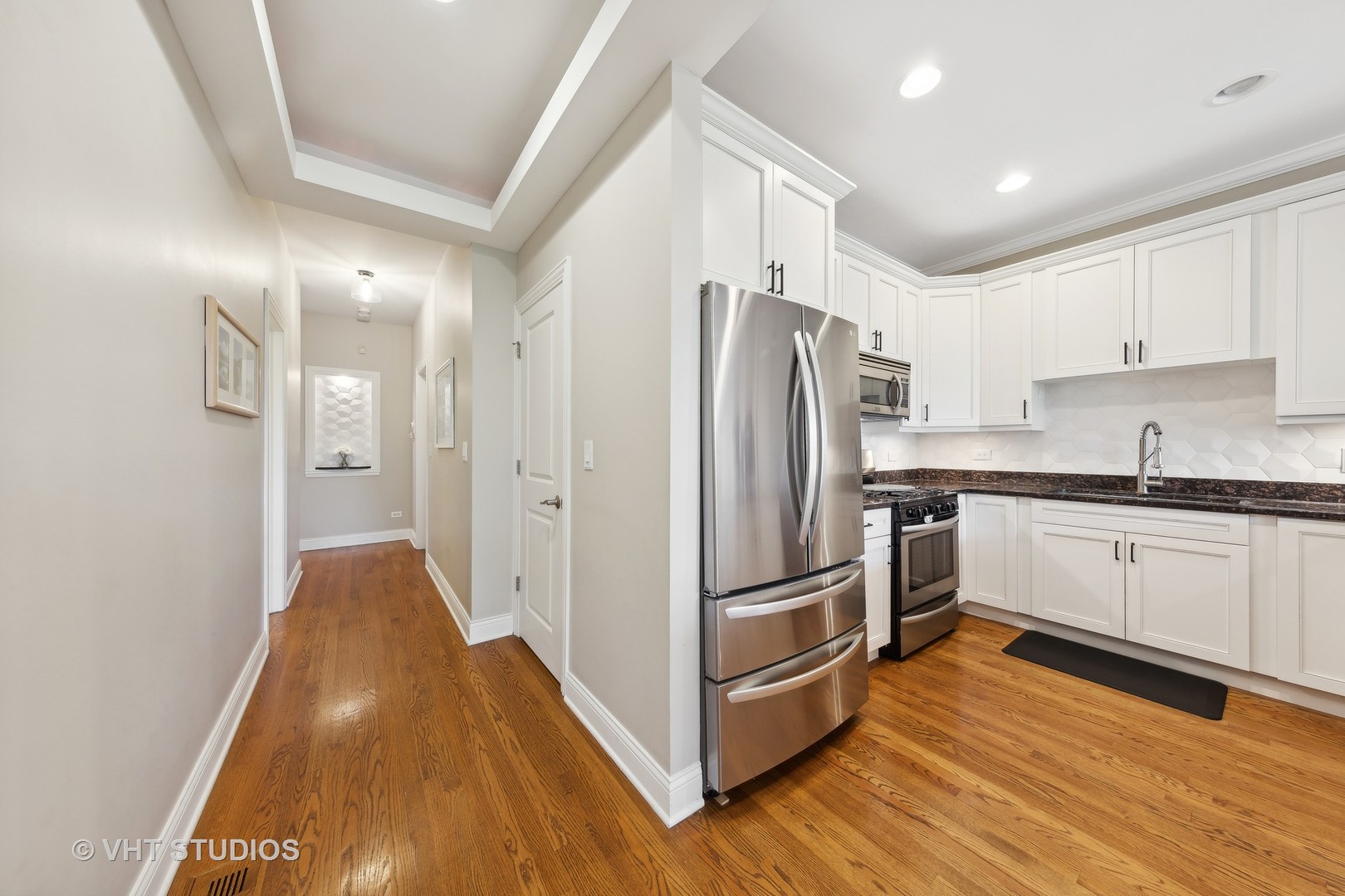 2136 West Division Street, Unit 3 Chicago, IL 60622 - Photo 13 of 37 a kitchen with stainless steel appliances a refrigerator and a stove top oven
